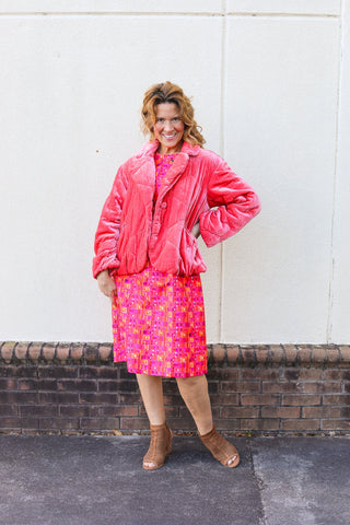 Model wearing a pink Anthropologie quilted jacket