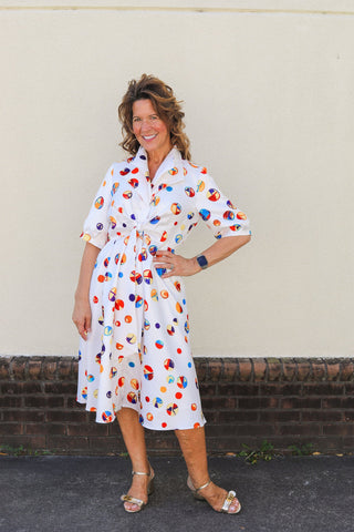 Model wearing the colorful Blythe dot dress